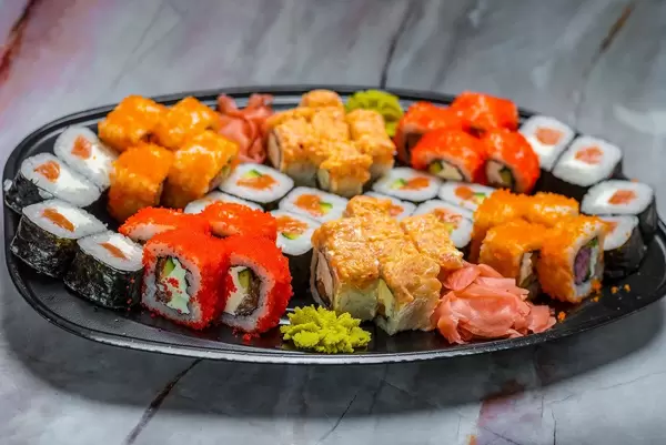 colorful Sushi Set nigiri and sushi rolls for two. Maki, scallop. (Flip 2019)