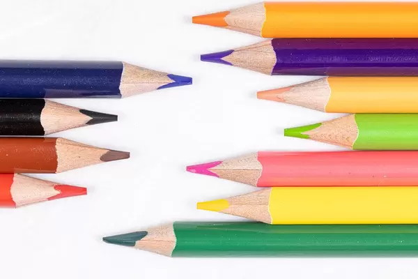 Colorful wooden pencils arranged on the table
