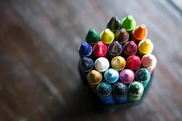 Coloured wax crayons on a table