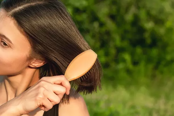 Comb on women's hair, close-up