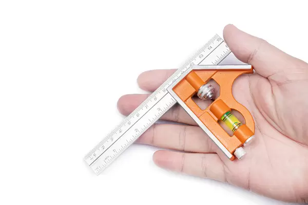 Combination Square in the hand above white background