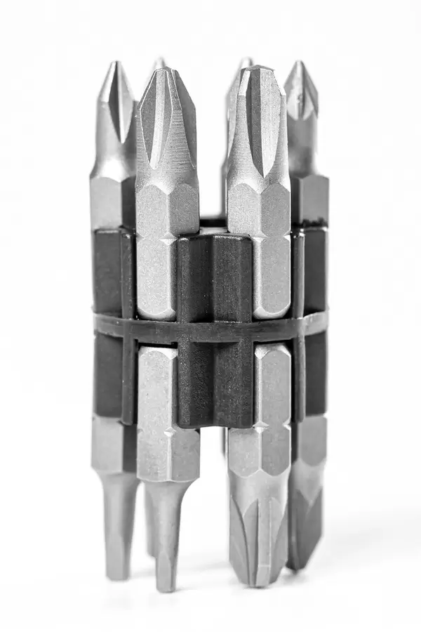 Compact set of screwdriver bits on white