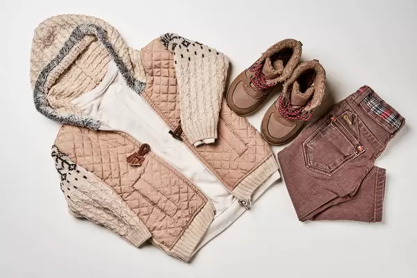 Composition with children clothes on white background