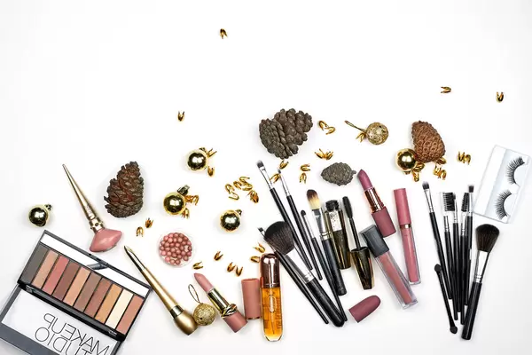 Composition with decorative cosmetics for winter season on white background