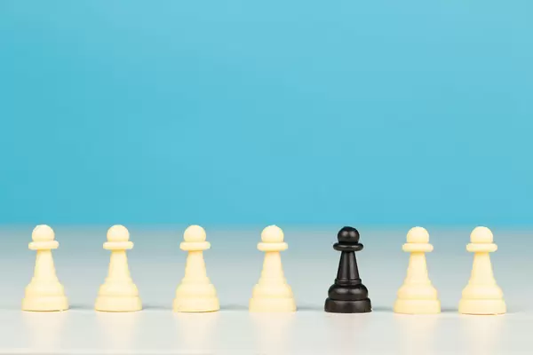 Concept be different, one in crowd, one black pawn with lot of white pawns