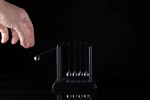 Concept For Action and Reaction in Business With Newton's Cradle (Flip 2019)