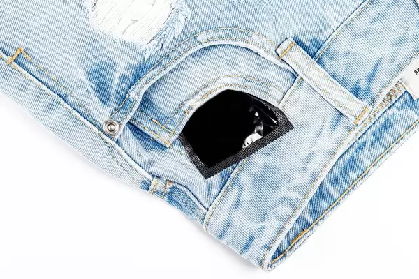Condom in the pocket of women's shorts. The concept of protection (Flip 2020)