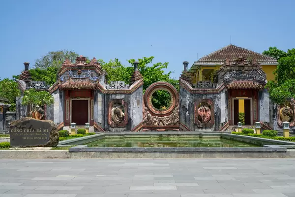 Cong Chua Ba Mu known as Ba Mu Temple Gate with large Pond at blue Sky in the Ancient Town of Hoi An, Vietnam
