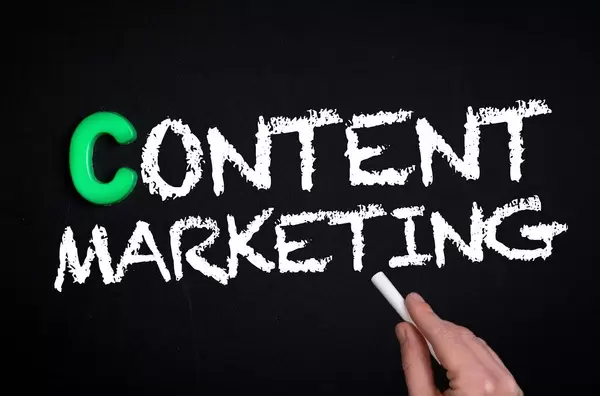 Content marketing text on blackboard