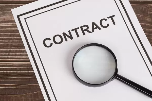 Contract with magnifying glass