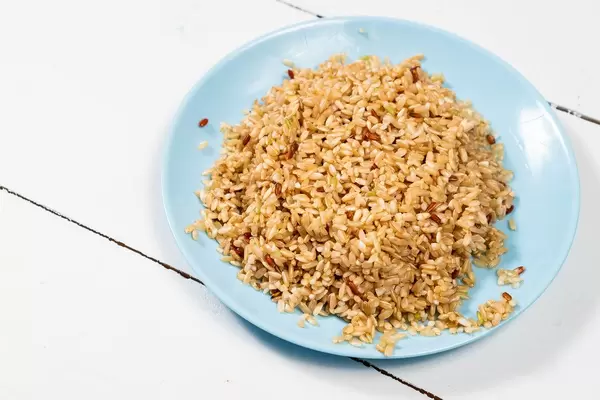 Cooked Integral Rice on the blue plate