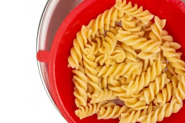 Cooked Pasta in the plastic colander