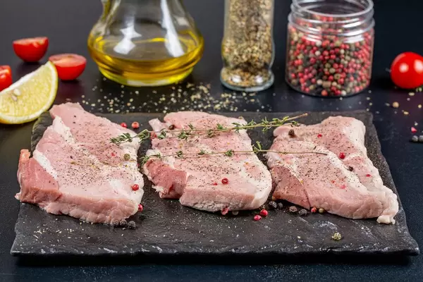 Cooking background-fresh raw steaks with spices