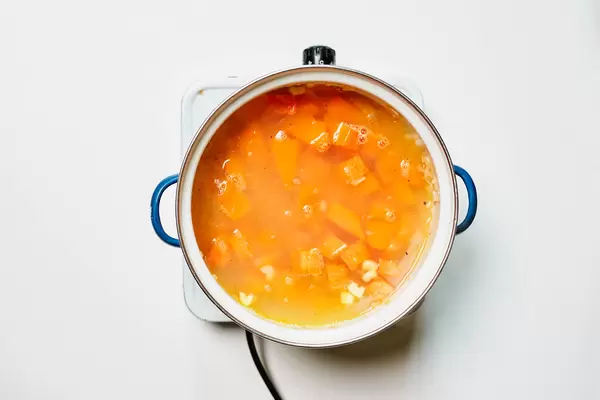 Cooking pumpkin soup with fresh pumpkin