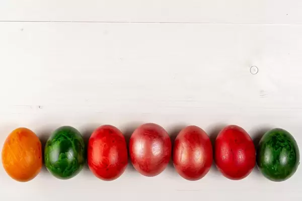 Copy space above wooden background and Colored Easter Eggs (Flip 2019)