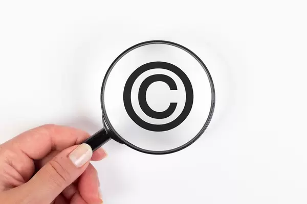 Copyright symbol under magnifying glass