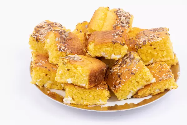 Cornbread on the plate above white background