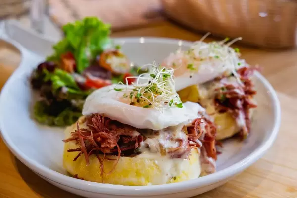 Corned beef burger meal with poached egg, bokeh shot