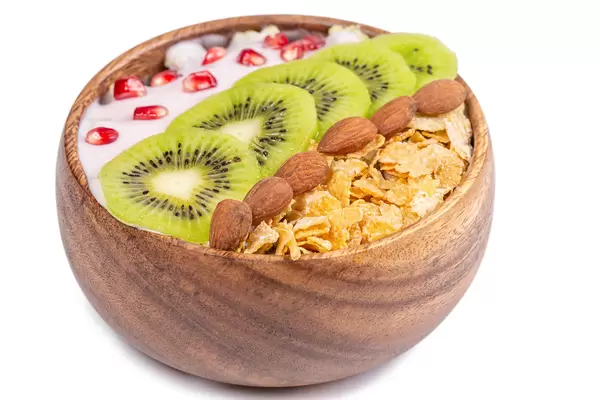 Cornflakes with yoghurt, fruits and almonds