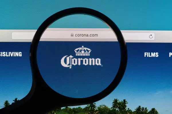 Corona logo under magnifying glass