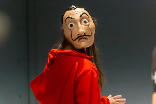 Cosplay at Gamescom: costume depicts a criminal with Salvador Dali mask from the Netflix crime-drama series Money Heist