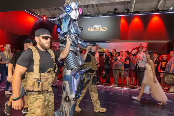 Cosplayers clad as soldiers and an alien at Gamescom