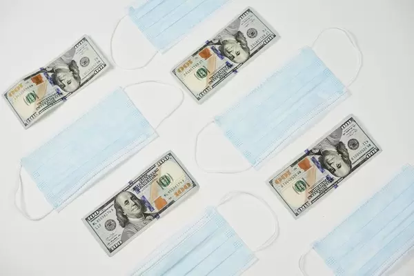 Cost of medical masks - Us dollars and medical face masks background