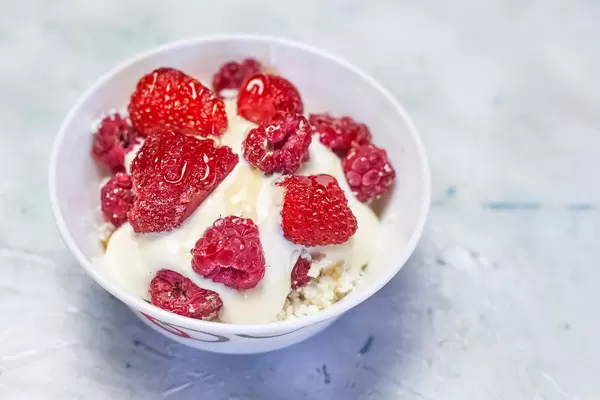 Cottage cheese and yogurt mix with strawberry and raspberry