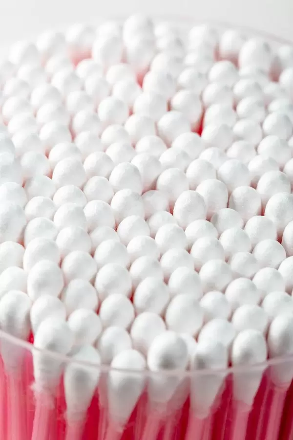 Cotton swabs in transparent plastic box