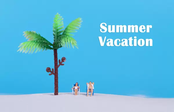 Couple at sandy beach and Summer Vacation text