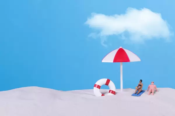 Couple in bath suit on the beach