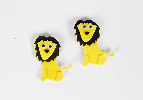 Couple of lion toys isolated on white