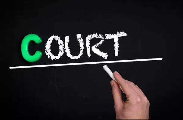 Court text on blackboard