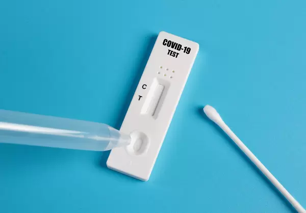 Covid-19 Antigen test on blue background