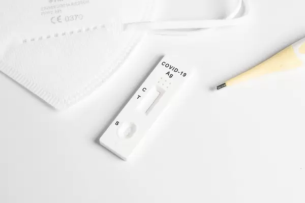 Covid 19 Antigen test with thermometer and face mask