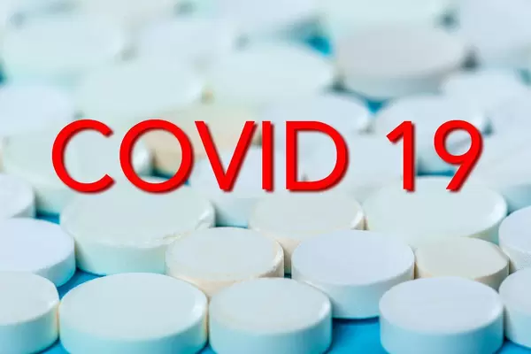 Covid 19 on the background of tablets