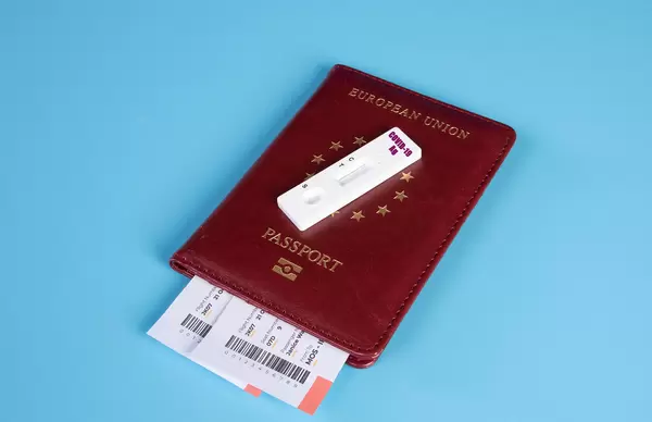 COVID-19 test cassette on passport