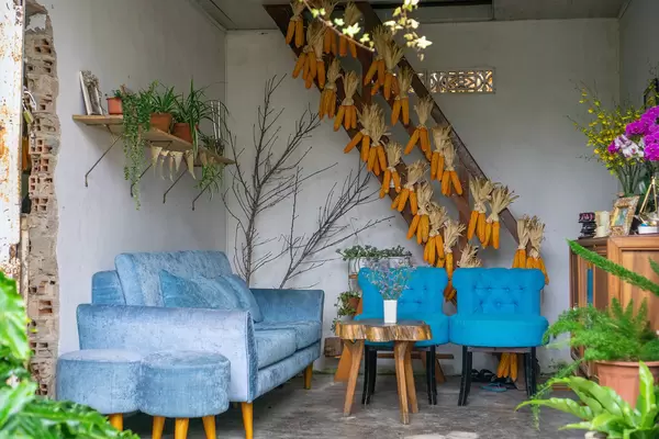 Cozy Cafe Space with Sofa and Couch Chairs and Corn on the Cob as Decoration