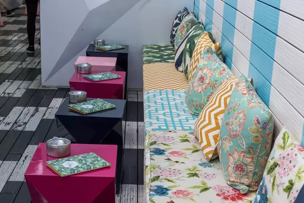 Cozy padded bench at Lamee Rooftop Bar in Vienna