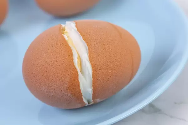 Cracked Hard Boiled Egg on the blue plate (Flip 2019)