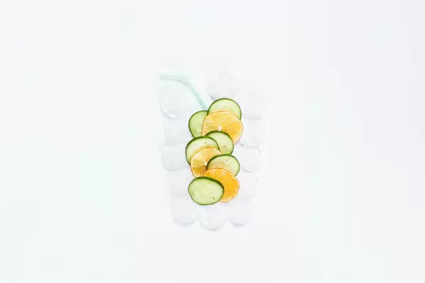 Creative concept of refreshing summer cocktail on white background