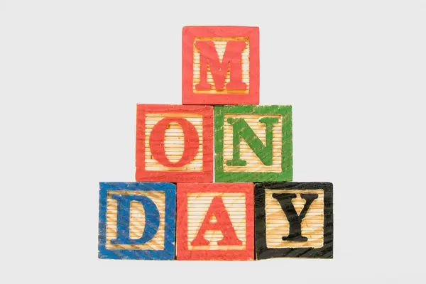 Creative Monday text formed by wooden blocks