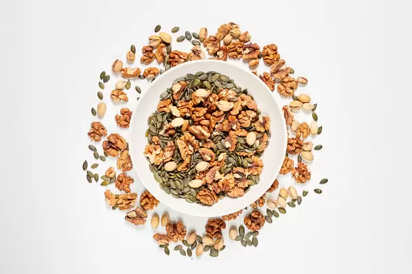 Creative variety of nuts on white background