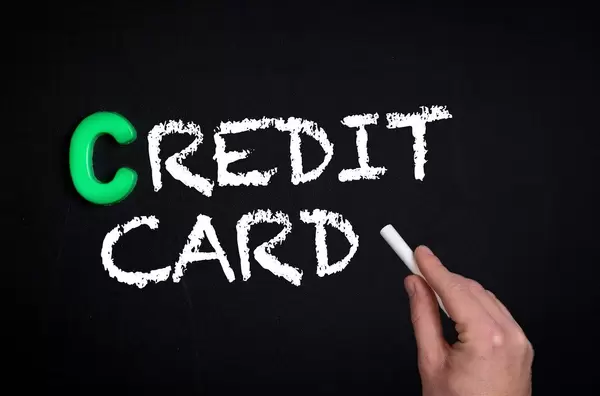 Credit card text on blackboard