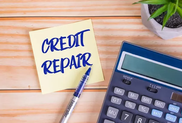 Credit repair text on a sticky note