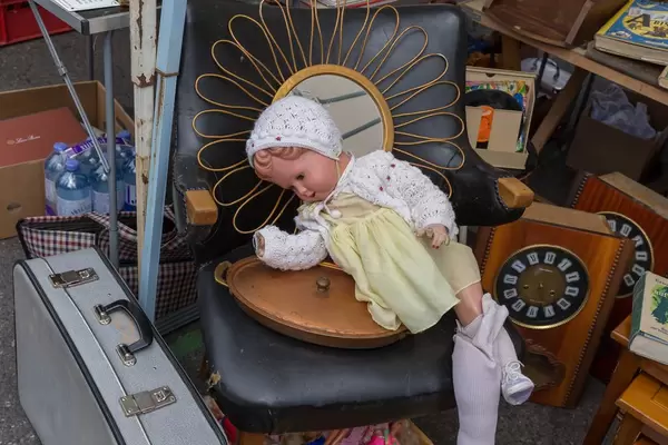 Creepy doll with parts missing at the Naschmarkt flea market in Vienna