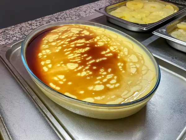 Creme Brulee in a big casserole at a buffet