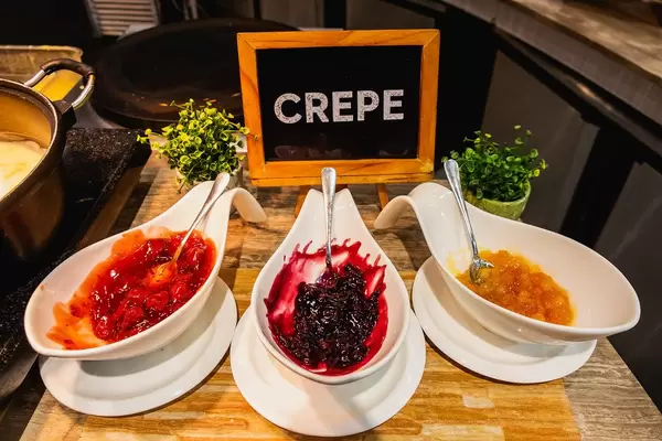 Crepe fillings on wooden table