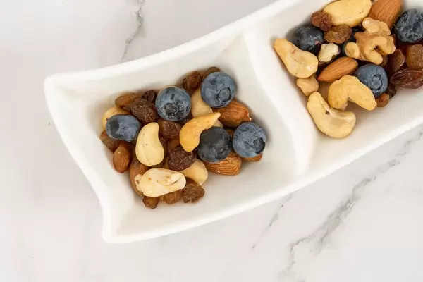 Crispbreads Blueberries Almonds Raisins and other in the bowl