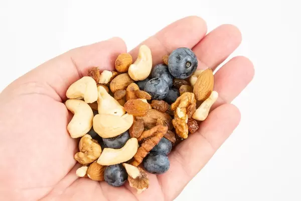 Crispbreads Blueberries Almonds Raisins and other in the hand